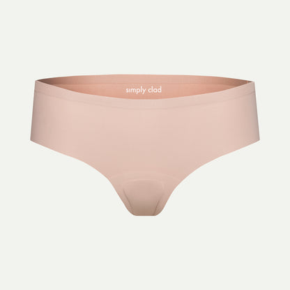 Beige camel toe proof thong underwear with seamless front and wide waistband, featuring “simply clad” logo — designed for invisible fit under leggings and everyday wear.