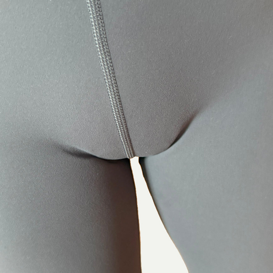 Close-up of gray leggings with Simply Clad camel toe proof underwear without visible lines and smooth fit.