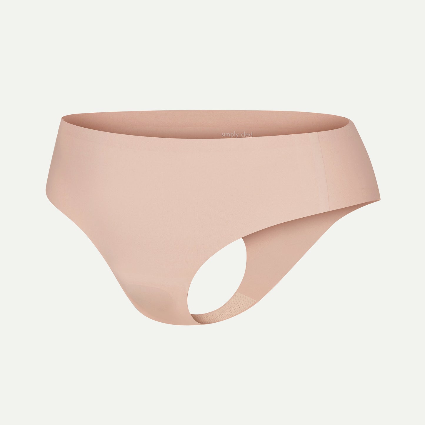 Side view of beige camel toe proof thong underwear with seamless construction, no front seam, and soft stretchy fabric — designed for invisibility under leggings and anti-wedgie comfort.