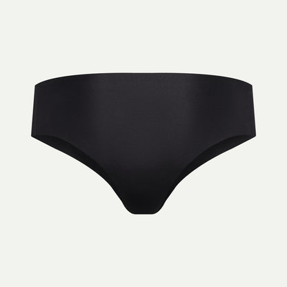 Back view of black camel toe proof thong featuring a wide, seamless back that prevents wedgies and digging in — ideal for comfort and invisible wear under leggings.