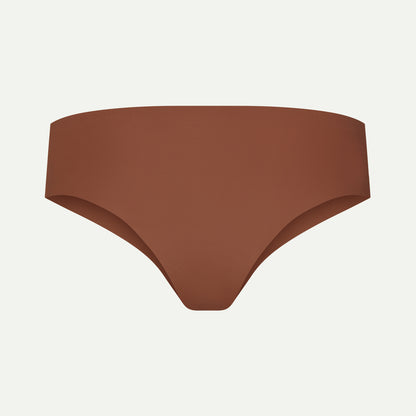 Back view of brown camel toe proof thong with wide, seamless back that stays in place — no wedgies, no digging in, just smooth invisible fit under leggings.